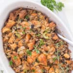 This Life-Changing Easy Thanksgiving Stuffing is my go-to stuffing recipe! Homemade stuffing is the best when made with fresh herbs, torn-apart bread, and mushrooms! A must-have this holiday!