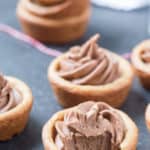 Peanut Butter Nutella Fudge Cookie Cups are so soft and fluffy and filled with an outrageous Nutella fudge frosting! Can be made in a regular muffin tin or even in a mini!