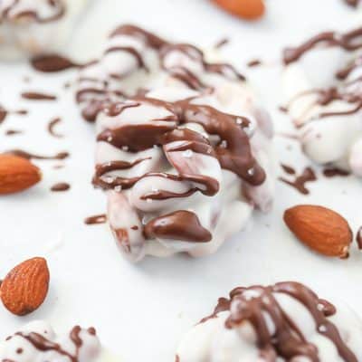 Only 5 minutes are needed to make these out-of-this-world White Chocolate Almond Clusters! A simple, easy, and delicious candy recipe everyone needs to have! Makes for delicious homemade gifts! Can be made with almonds or with peanuts - you choose!