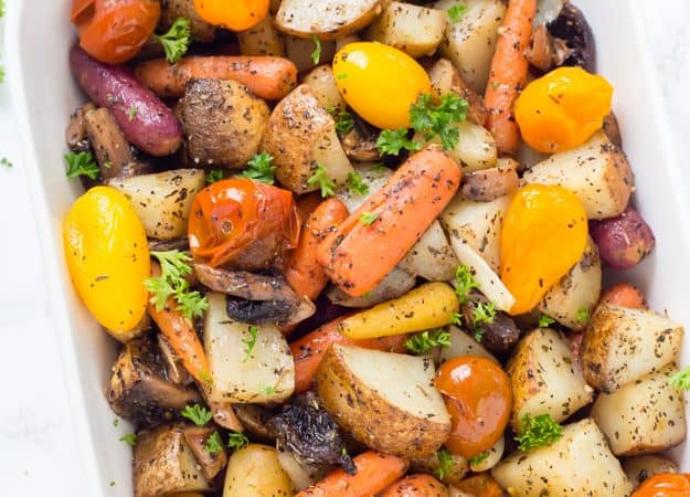Easy Italian Roasted Vegetables are bursting with flavor from potatoes, carrots, tomatoes, and garlic. You will want to make these oven roasted vegetables with all of your meals! 