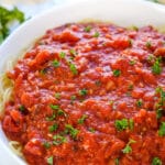 This Homemade Spaghetti Sauce recipe is so much better than any storebought sauce and is incredibly easy! It's the best sauce you will ever make and only requires a few essential ingredients. Plus, it freezes well.