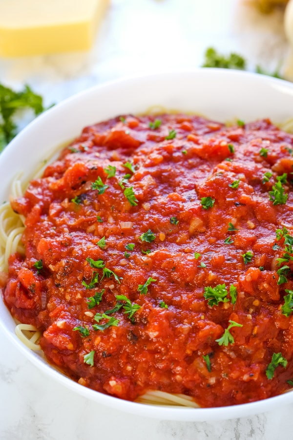 This Homemade Spaghetti Sauce recipe is so much better than any storebought sauce and is incredibly easy! It's the best sauce you will ever make and only requires a few essential ingredients. Plus, it freezes well.