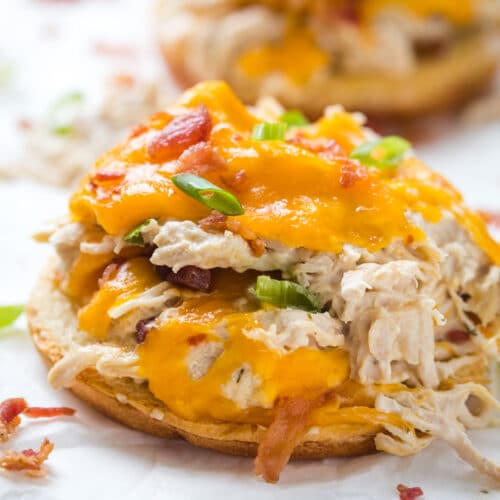 Crockpot Crack Chicken served on a bun with a white background